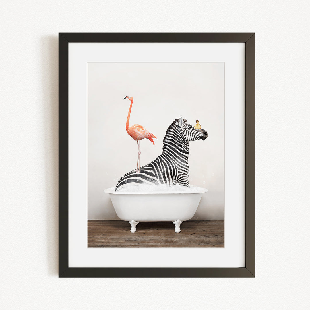 A framed image depicting a zebra standing in a bathtub, with a flamingo perched on its back.