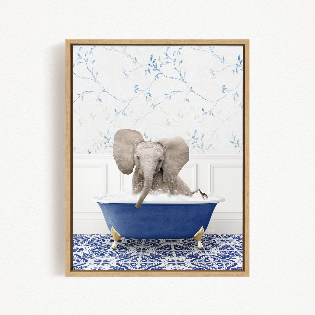 A gray elephant is sitting in a blue bathtub filled with water, surrounded by a blue and white patterned rug on the floor.