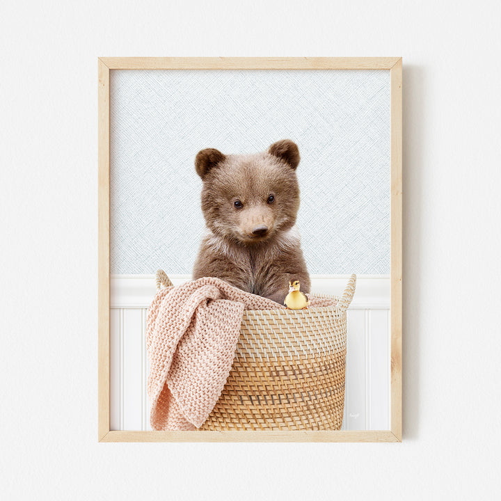 a picture of a teddy bear sitting in a basket