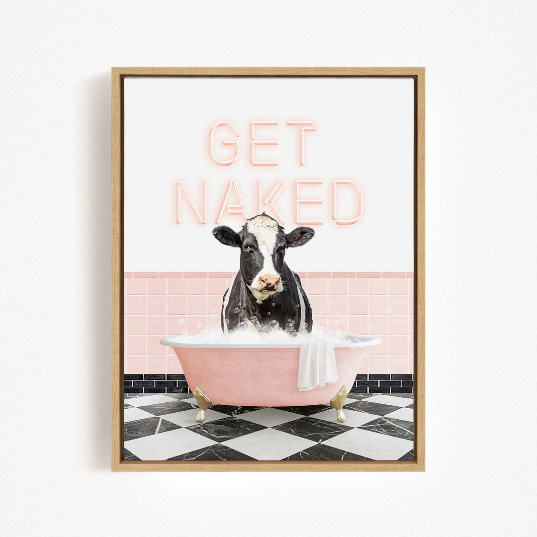 A cow sitting in a pink bathtub with the text "GET NAKED" displayed above it.