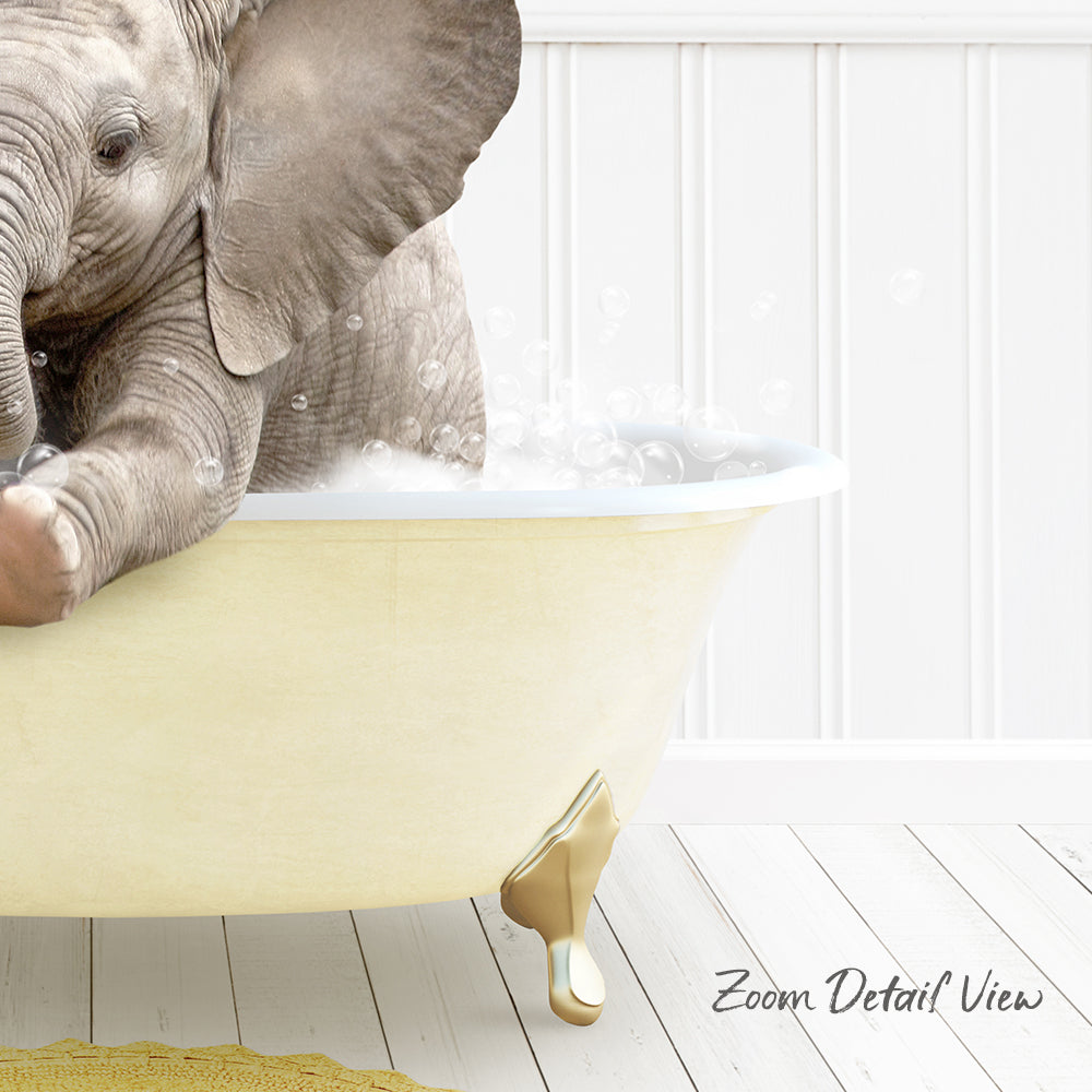A baby elephant sitting in a bathtub filled with water, surrounded by bubbles.