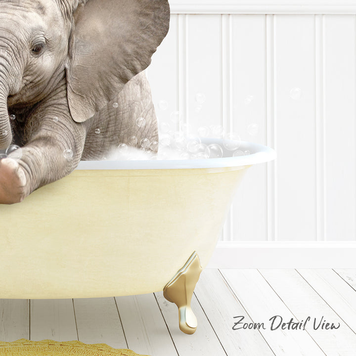 A baby elephant sitting in a bathtub filled with water, surrounded by bubbles.
