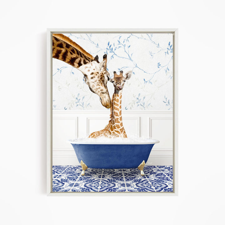 A mother giraffe and her baby giraffe are sitting together in a blue bathtub, with the mother gently licking her baby.