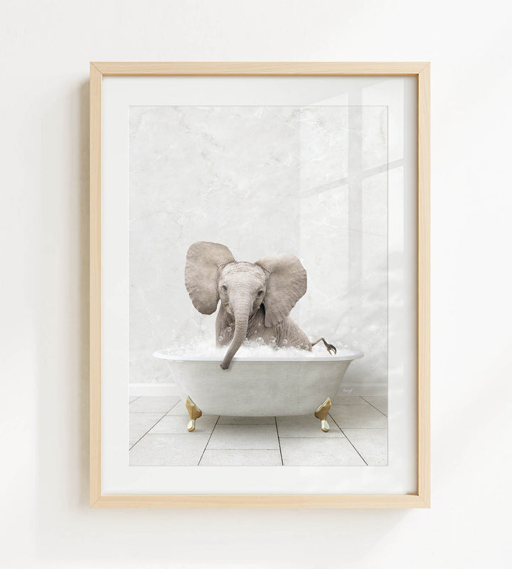A baby elephant sitting in a white bathtub filled with water, surrounded by a white background.