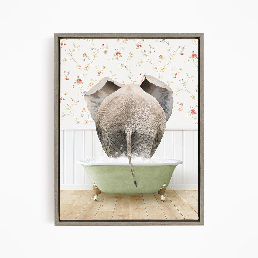 An elephant is standing in a green bathtub filled with water, with its trunk submerged in the water.