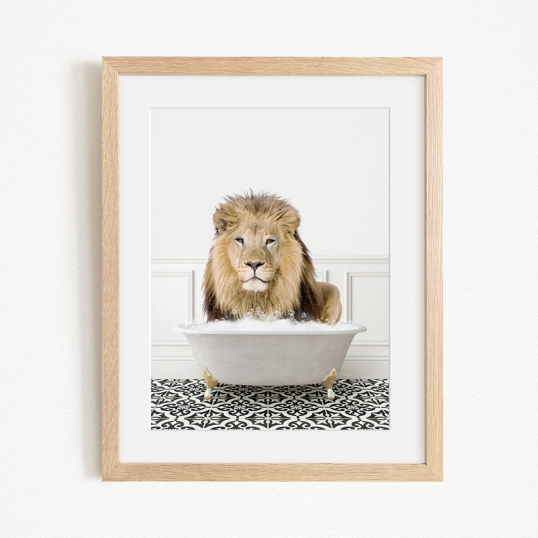 A lion sitting in a white bathtub filled with bubbles, surrounded by a black and white patterned rug.
