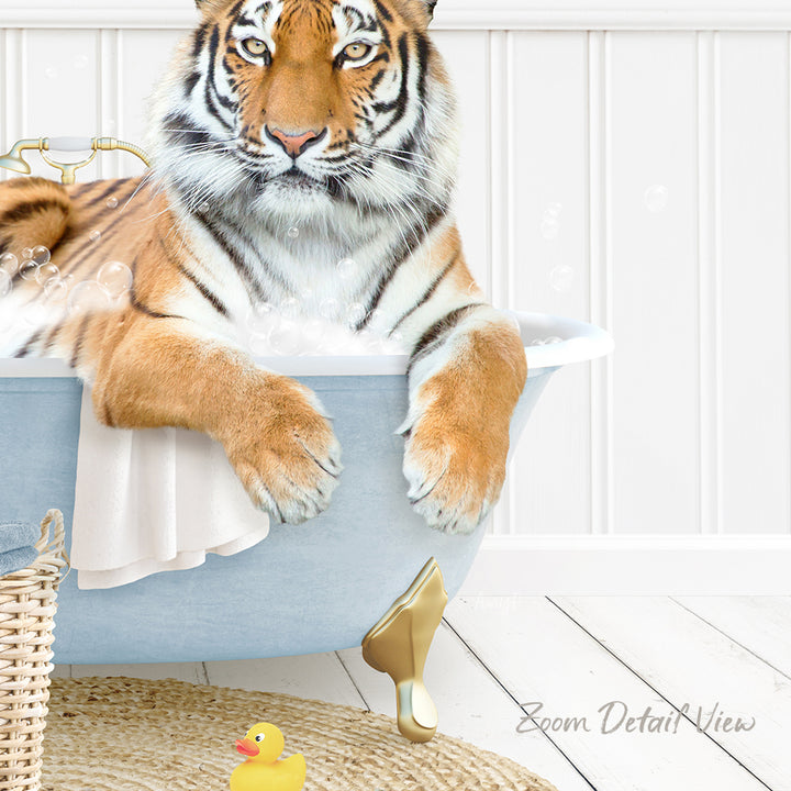 A tiger is sitting in a bathtub filled with water, surrounded by a yellow rubber duck and a white basket.