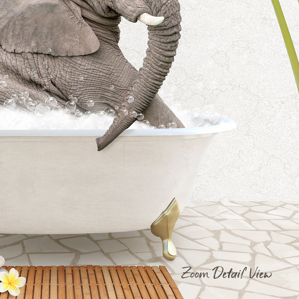 A large elephant is sitting in a bathtub filled with water, surrounded by a wooden mat and a yellow flower.