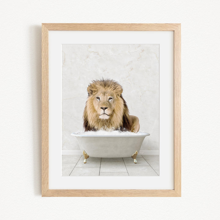 A lion sitting in a white bathtub, with its head resting on the edge of the tub.