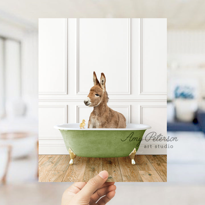 a dog sitting in a green bath tub