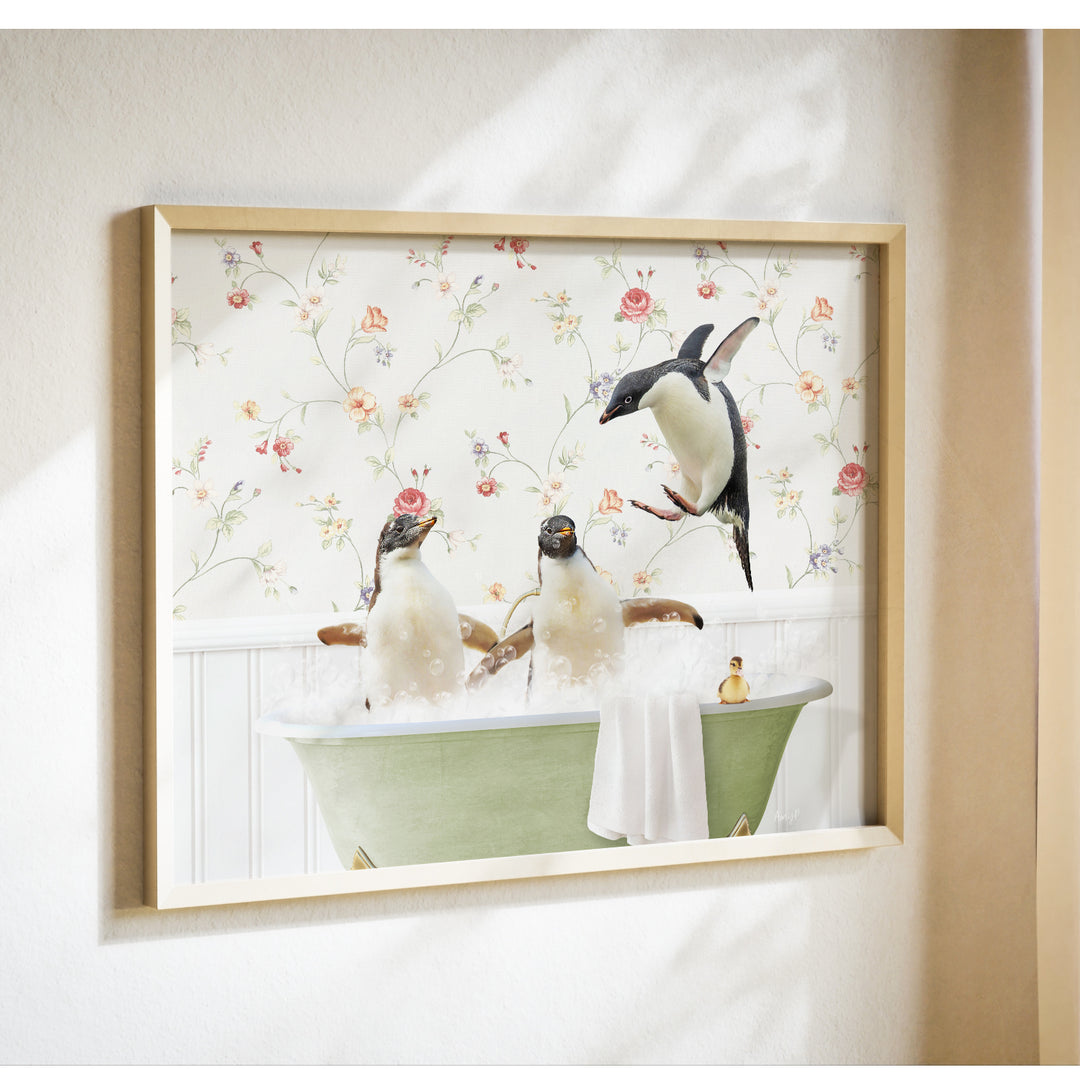 A framed image depicting three penguins sitting in a bathtub, with one penguin flying towards the others.
