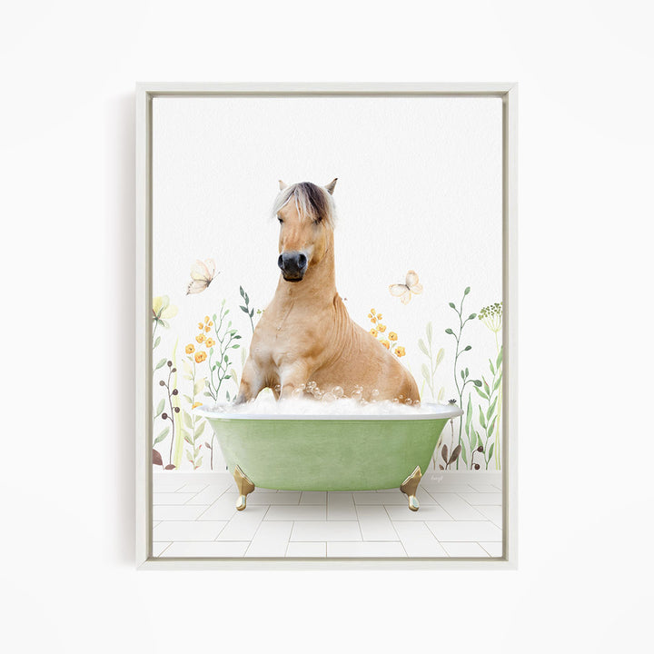 A light brown horse is sitting in a green bathtub filled with bubbles, surrounded by flowers and butterflies.