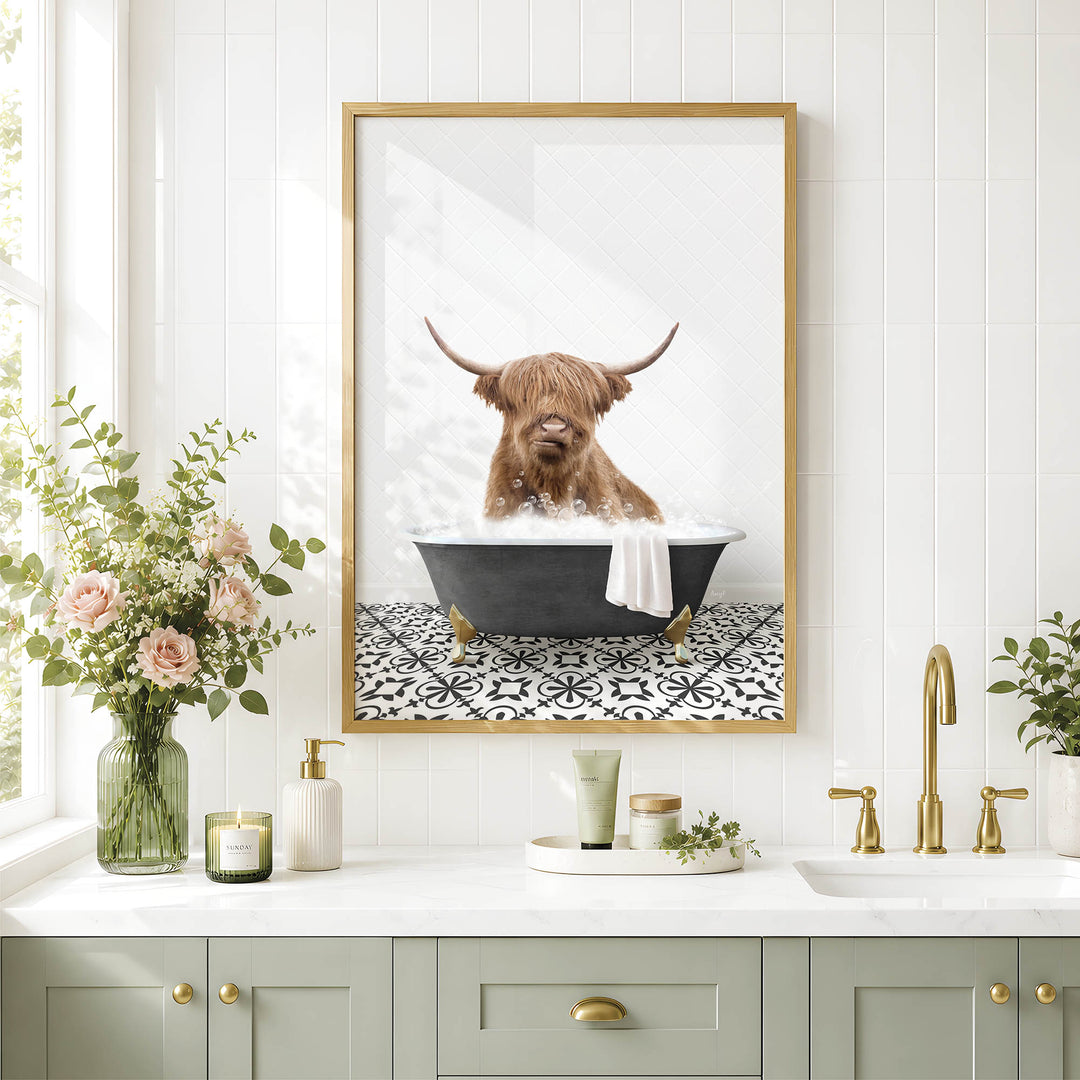 a bathroom scene with a framed picture of a Highland cow sitting in a bathtub, surrounded by flowers and a decorative vase.