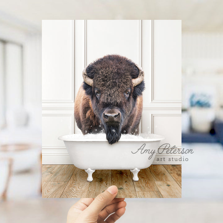 a bison is standing in a bathtub with his head sticking out of the tub