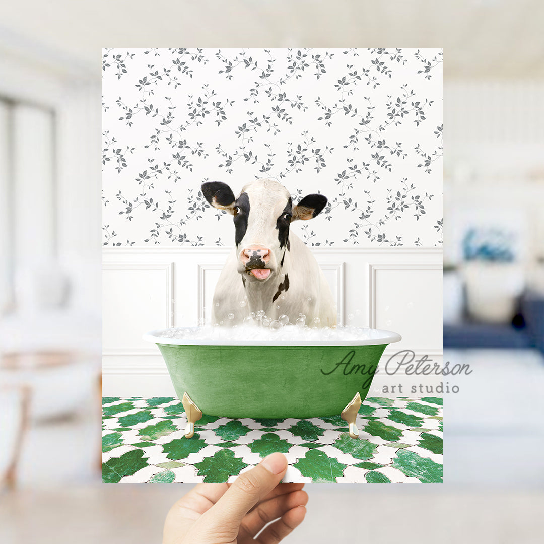 a person holding up a card with a picture of a cow in a bathtub