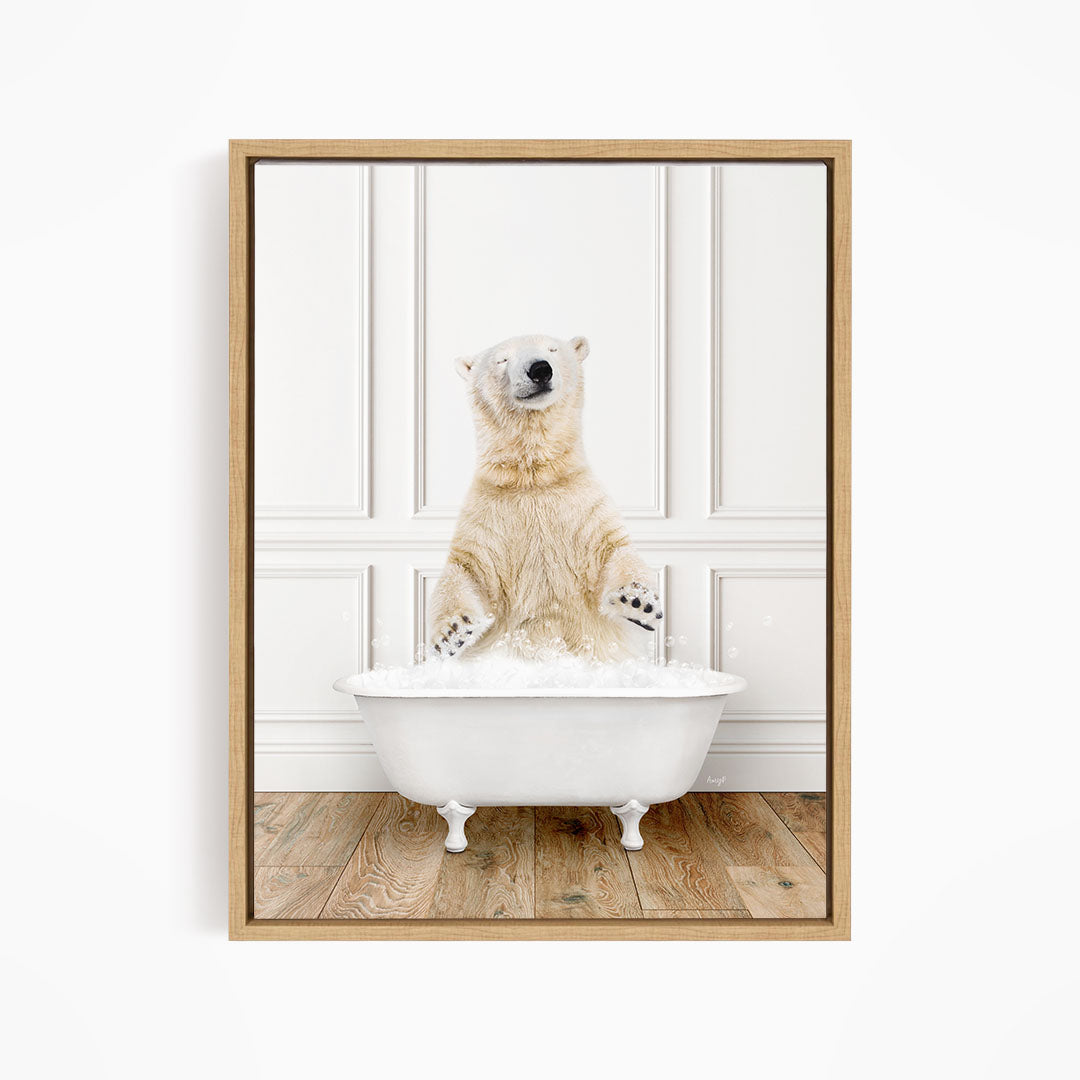 A polar bear is sitting in a white bathtub filled with water, appearing to enjoy the bath.