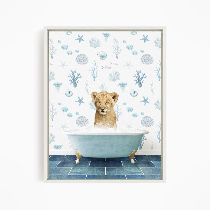 A young lion cub is sitting in a blue bathtub filled with water, surrounded by a pattern of seashells, starfish, and other marine life.