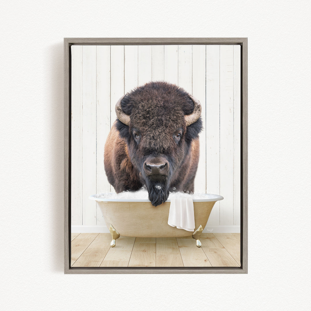 A buffalo with a long beard is sitting in a bathtub, looking directly at the camera.