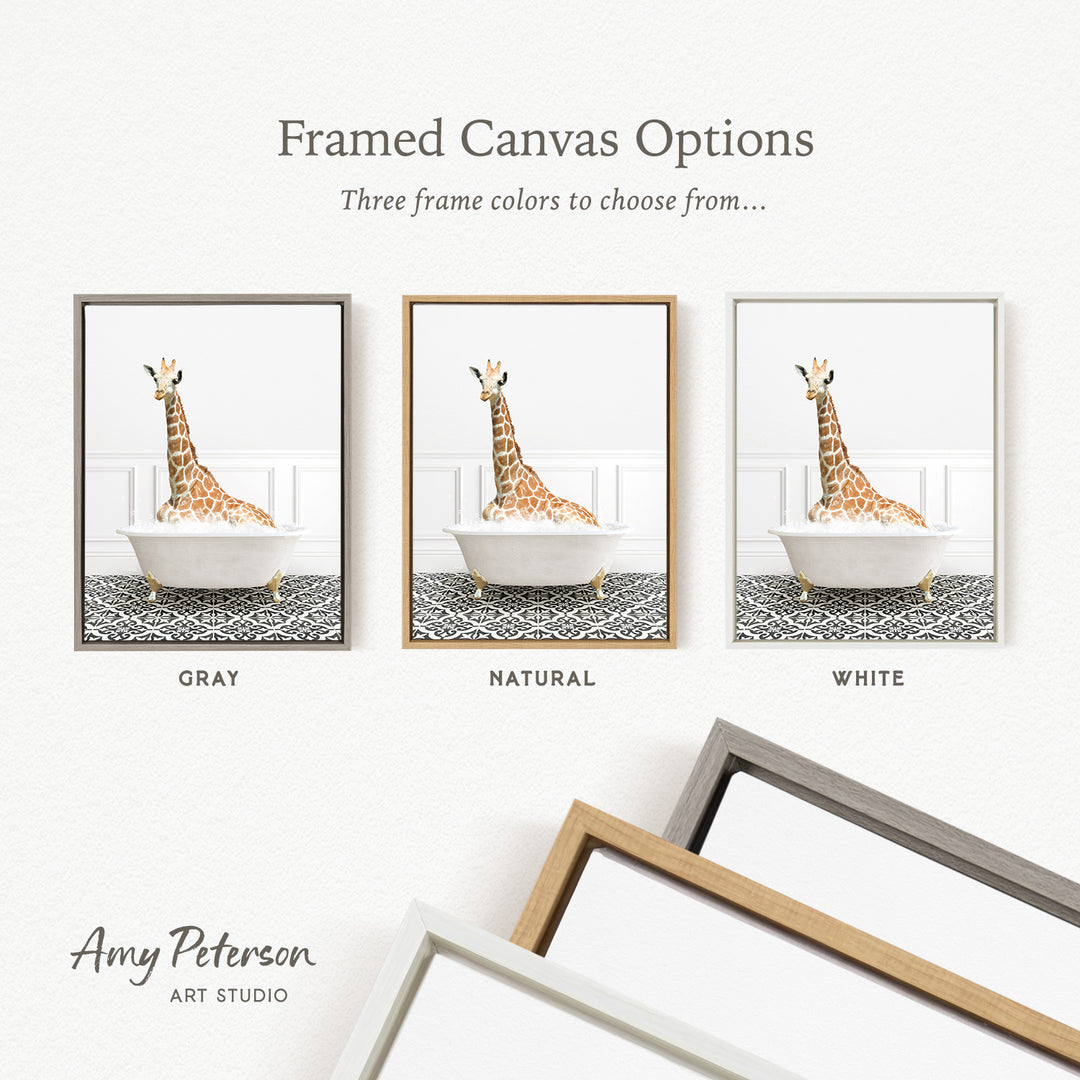 three framed canvas options, each featuring a giraffe sitting in a bathtub. The options include a gray frame, a natural frame, and a white frame.