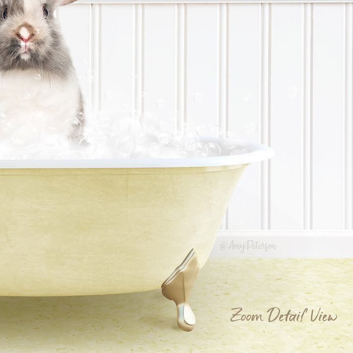 A small rabbit sitting in a bathtub filled with bubbles, with a white wall in the background.