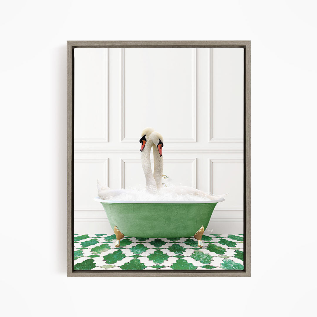 A pair of swans sitting in a green bathtub filled with bubbles, with a white wall and green and white patterned floor in the background.