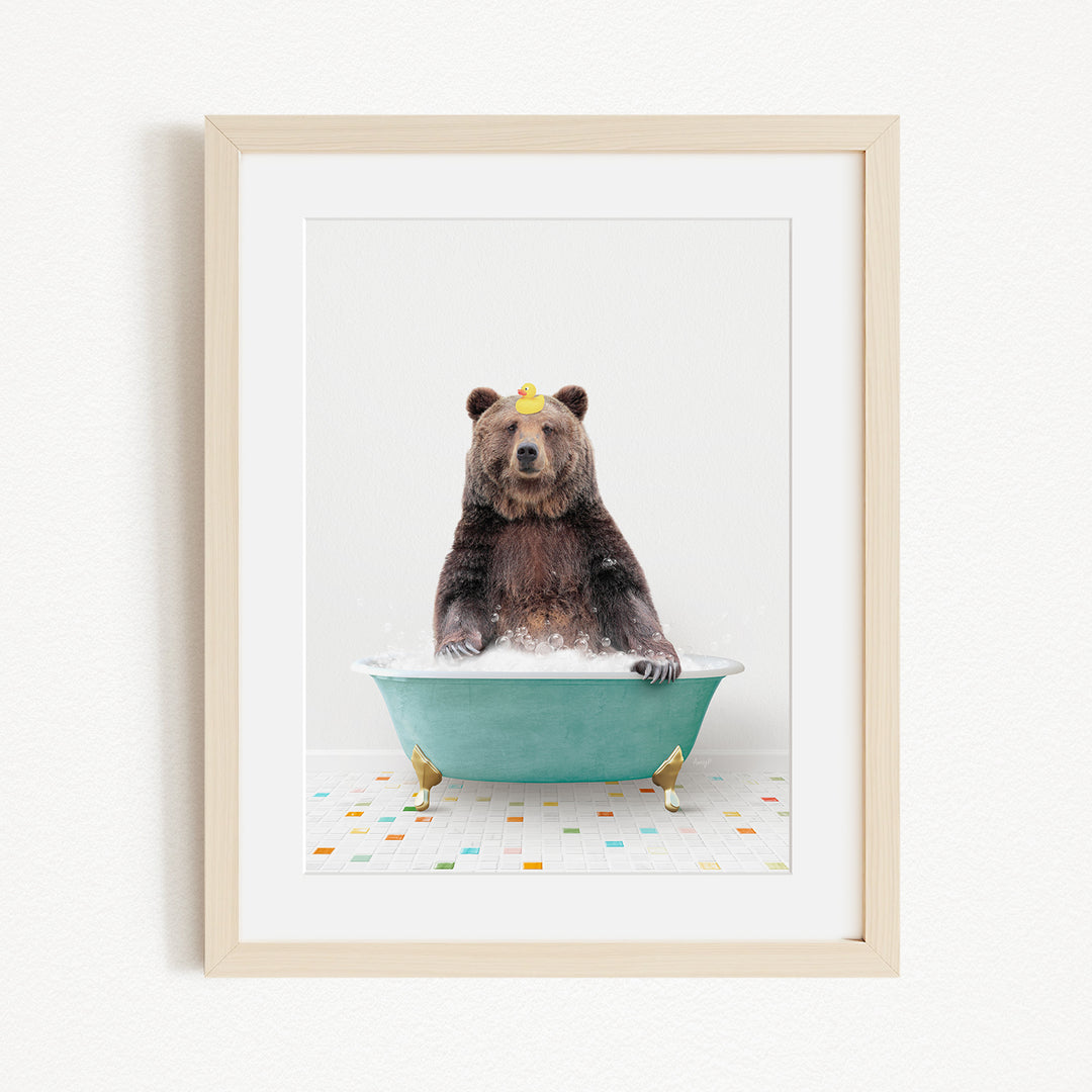 A brown bear sitting in a green bathtub filled with bubbles, with a yellow rubber duck floating on the water.