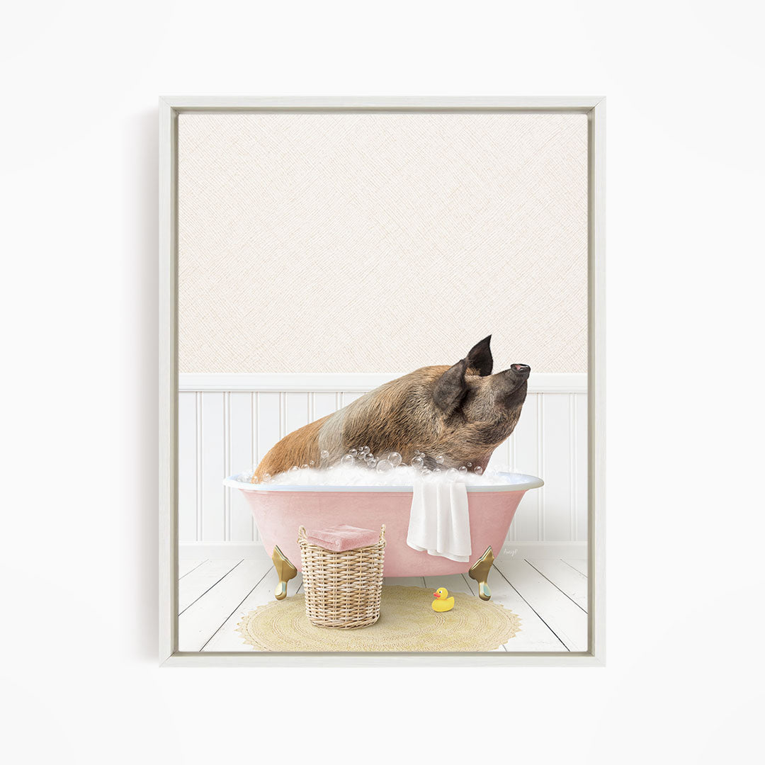 A brown pig sitting in a pink bathtub filled with bubbles, surrounded by a yellow rubber duck and a wicker basket.