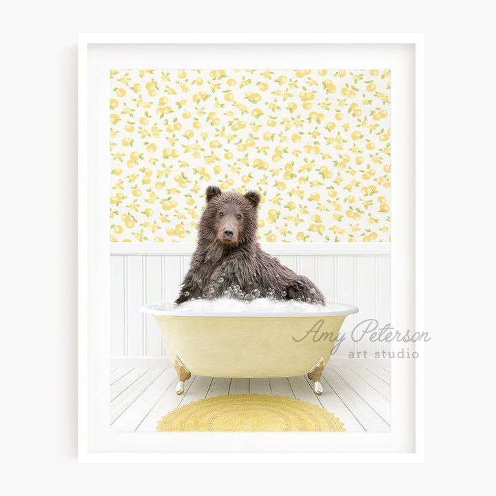 a brown bear sitting in a bathtub with a yellow rug