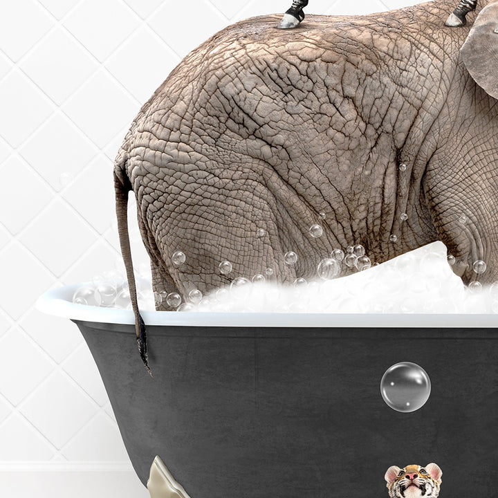 an elephant taking a bath in a bathtub