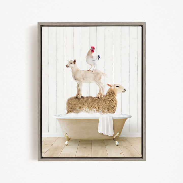 A framed image depicting a sheep standing on a tub with a rooster perched on top, and a lamb sitting on the tub's edge.