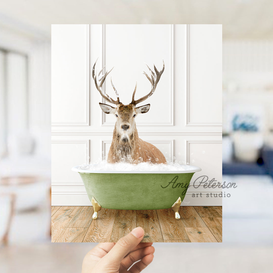 a hand holding a card with a picture of a deer in a bathtub