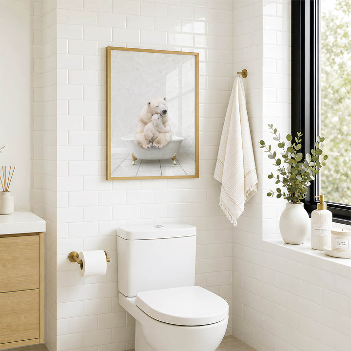 A bathroom with a white toilet, a framed image of a polar bear sitting in a bathtub, and a window with greenery on the sill.