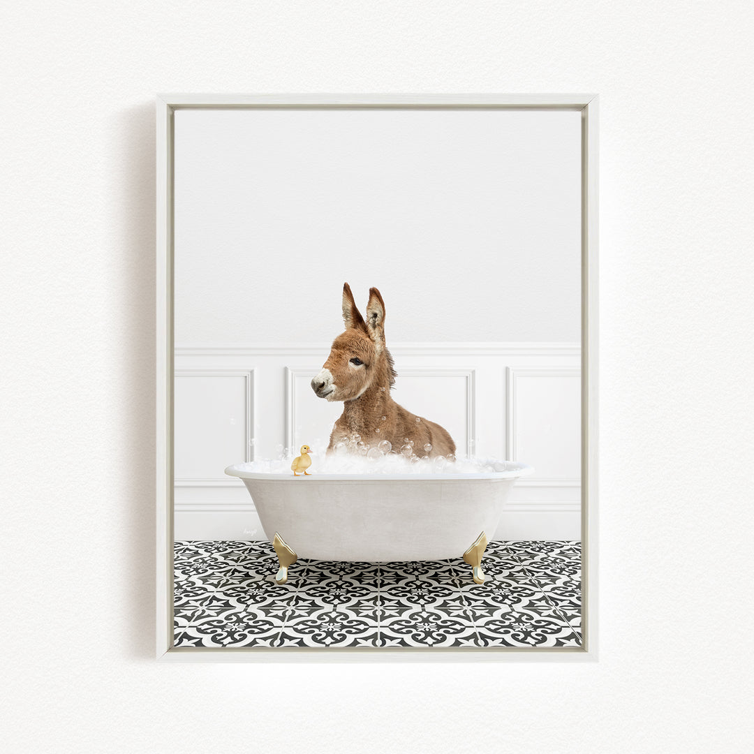 A donkey is sitting in a white bathtub filled with bubbles, surrounded by a patterned floor and a white wall.