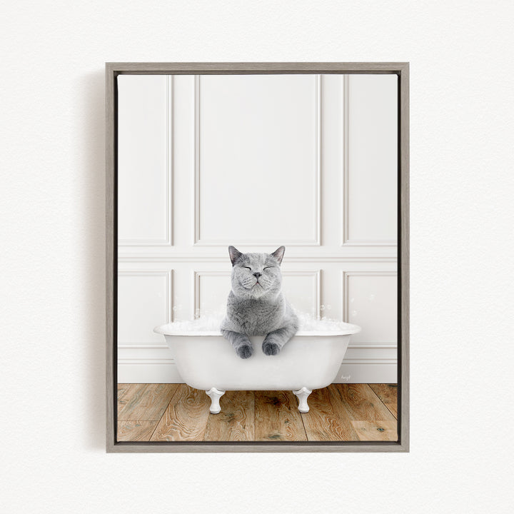 A gray cat sitting in a white bathtub, with its eyes closed, appears to be enjoying a relaxing bath.