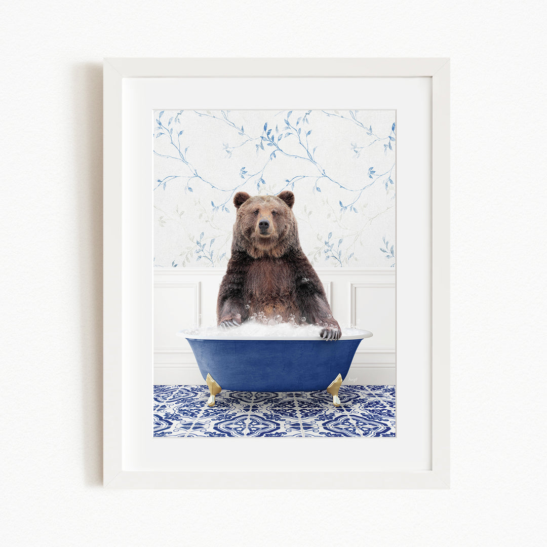A brown bear sitting in a blue bathtub filled with water, surrounded by a blue and white patterned floor.