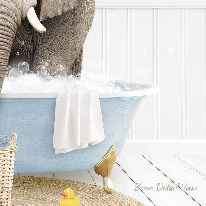 A blue bathtub filled with bubbles, with a white towel hanging on the side and a yellow rubber duck nearby.