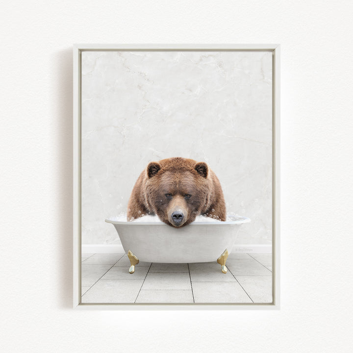 A brown bear is sitting in a white bathtub, appearing relaxed and content.