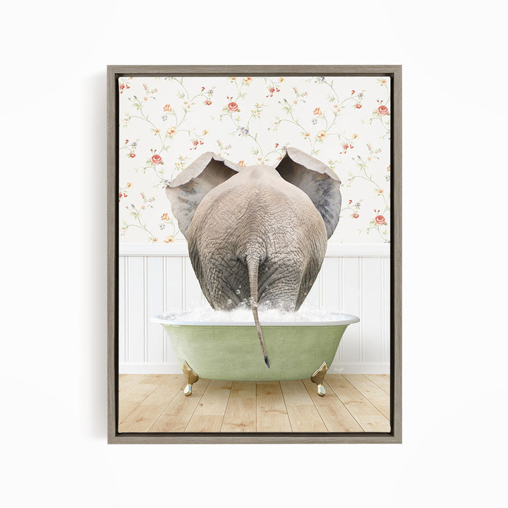 An elephant is standing in a green bathtub filled with water, with its trunk submerged in the water.