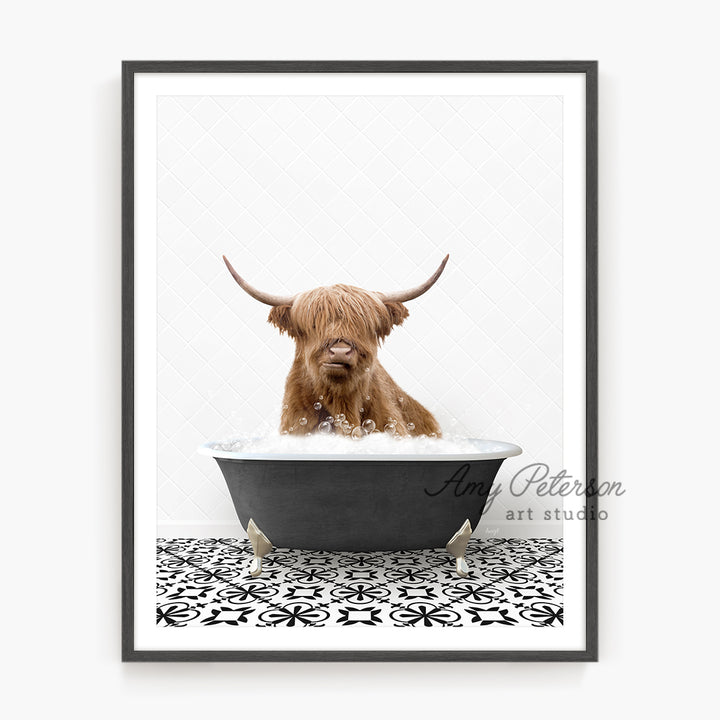 a framed photograph of a scottish bull in a bathtub