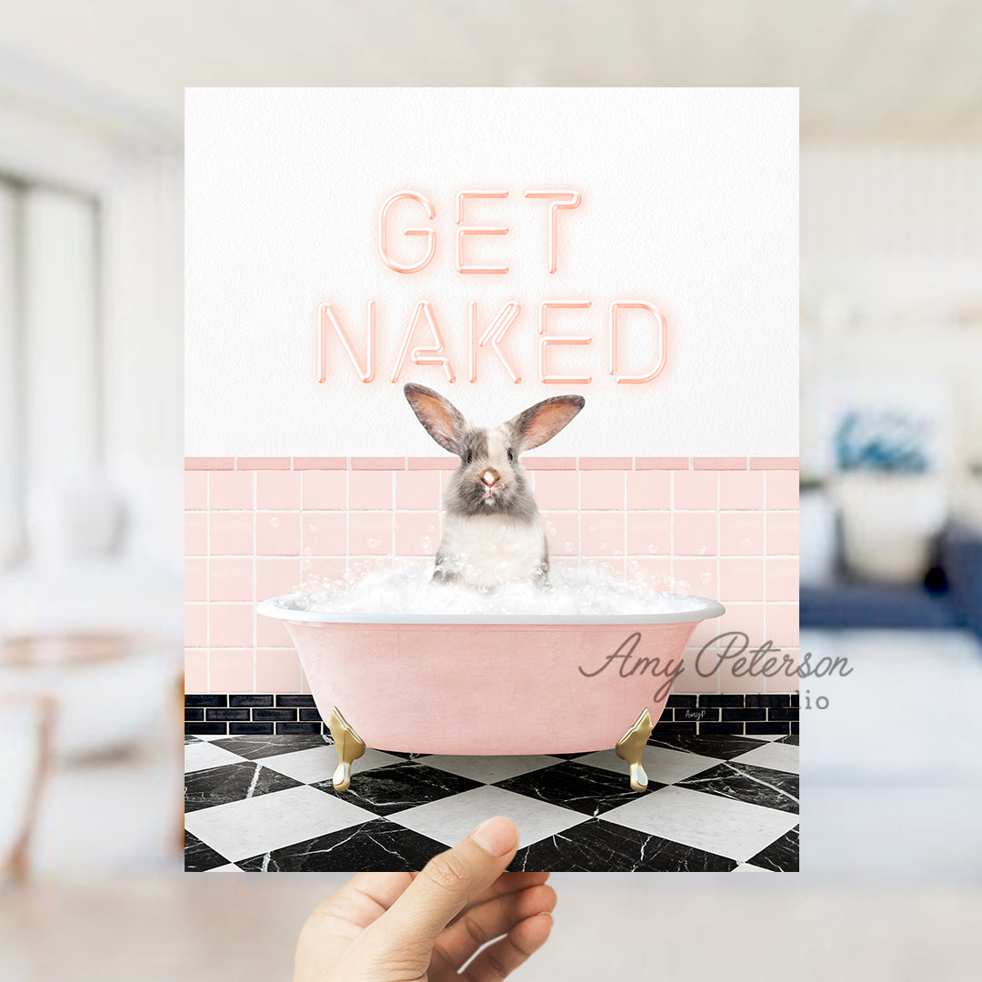 a person holding up a card with a picture of a bunny in a bathtub