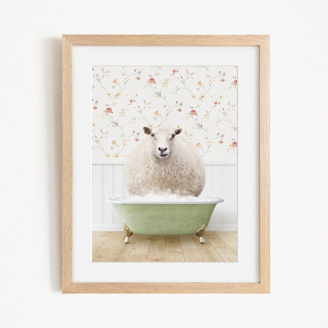 A fluffy white sheep sits in a green bathtub, surrounded by a floral wallpaper.