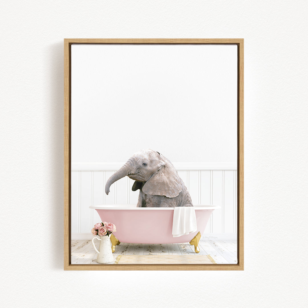 A gray elephant sits in a pink bathtub, surrounded by a white towel and pink flowers, creating a whimsical and charming scene.