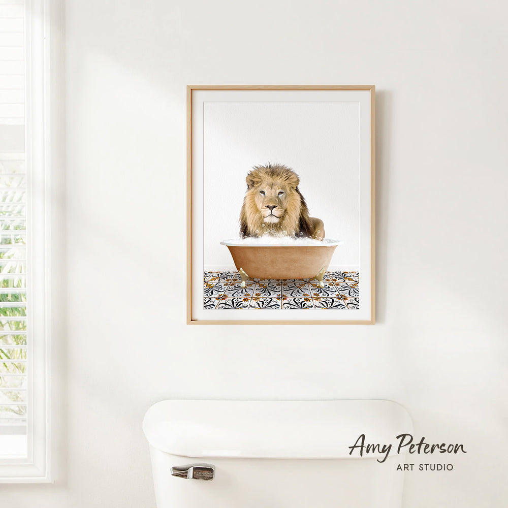 A framed image of a lion sitting in a bathtub, with a patterned mat on the floor.
