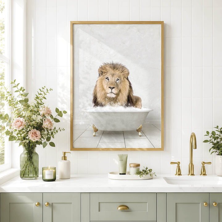 a framed picture of a lion sitting in a bathtub, surrounded by a vase of flowers, candles, and a tray of toiletries on a bathroom counter.