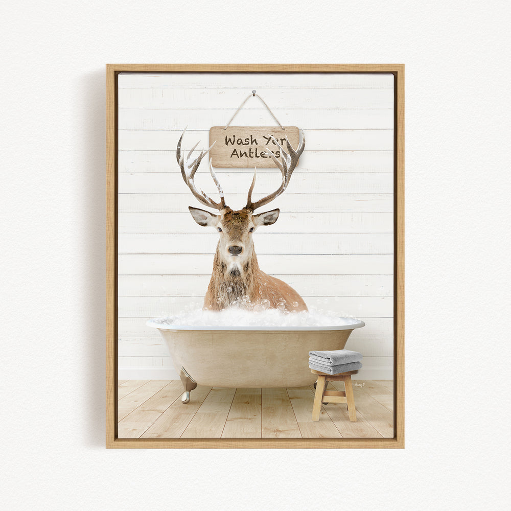A deer with antlers is sitting in a bathtub filled with water, with a sign above it that says "Wash your antlers".
