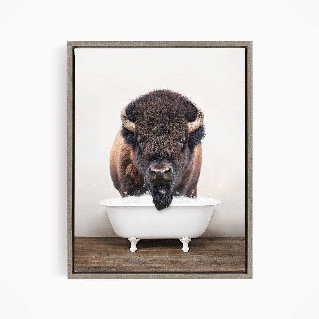 A buffalo with a long beard is standing in a white bathtub, with its head above the rim of the tub.