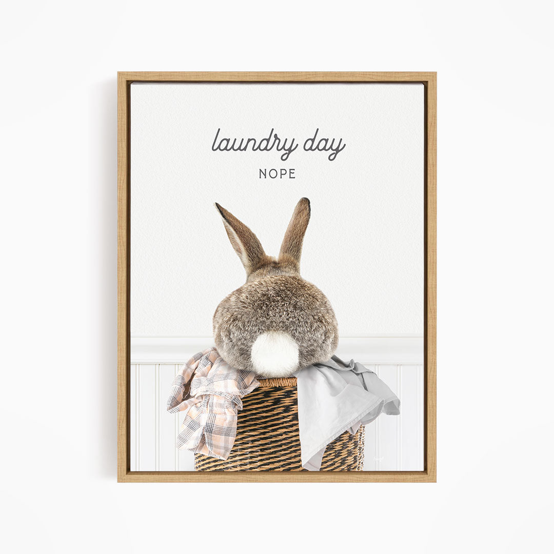 A picture of a rabbit sitting in a laundry basket, with the text "laundry day NOPE" above it.