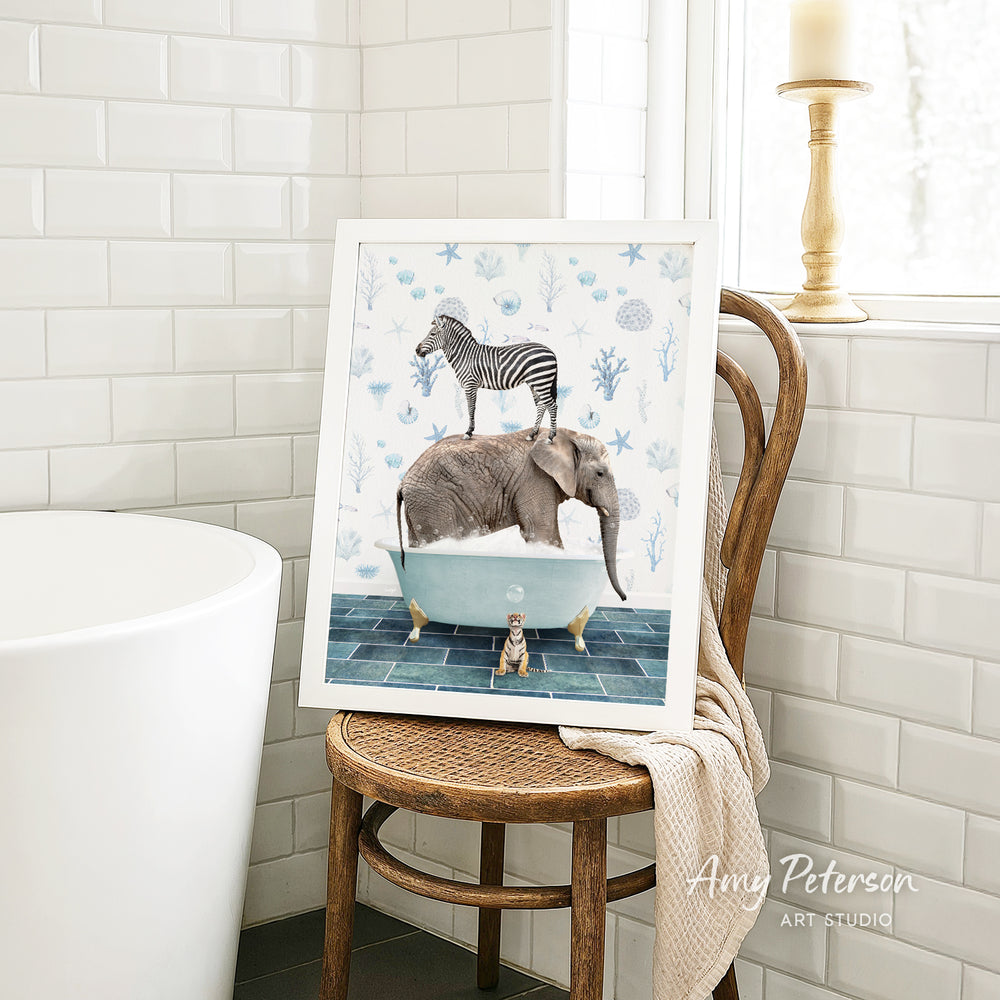 A framed illustration of a zebra standing on an elephant in a bathtub, surrounded by various sea creatures, is displayed on a wooden chair in a bathroom setting.