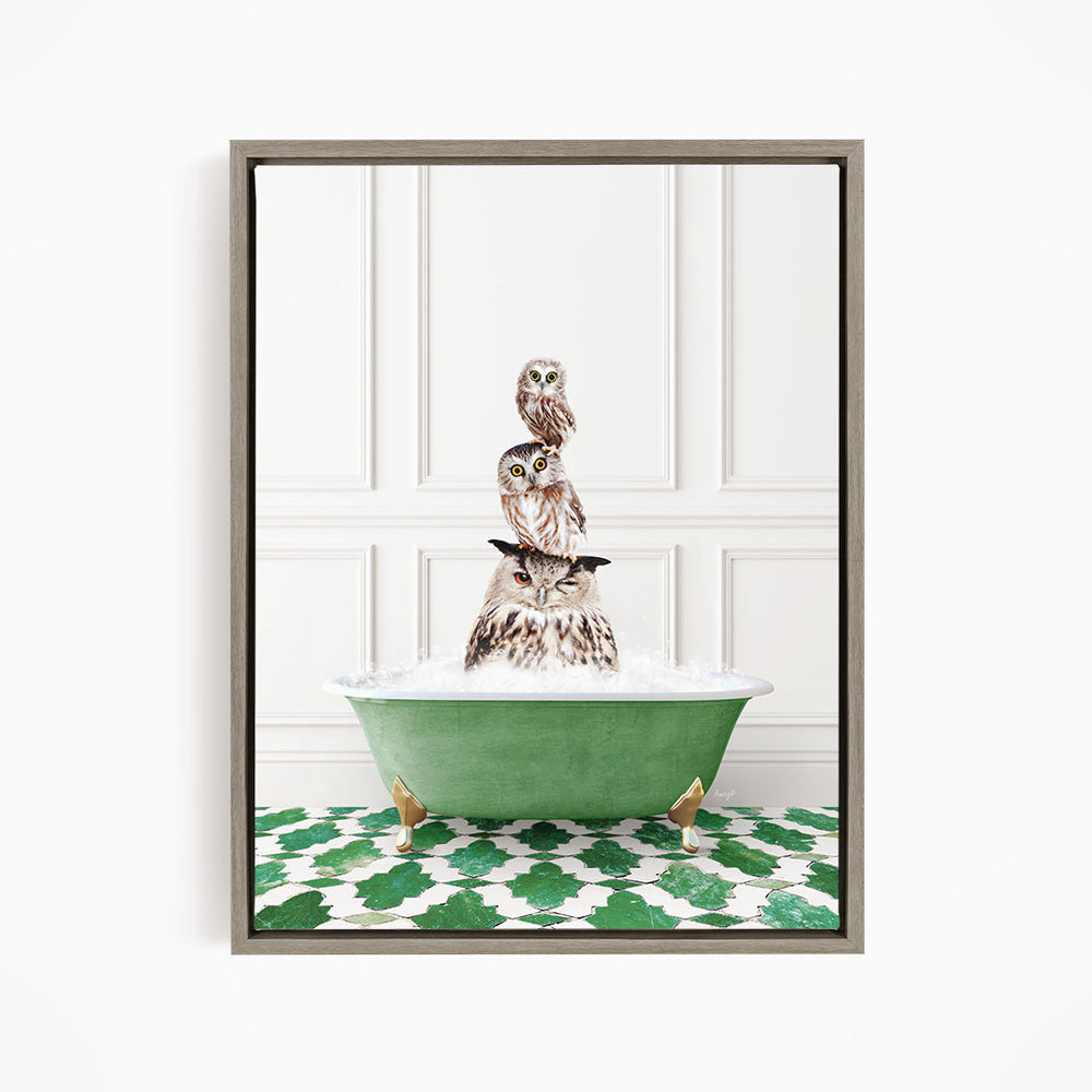 A framed image depicting a group of owls sitting in a green bathtub filled with water, creating a whimsical and playful scene.