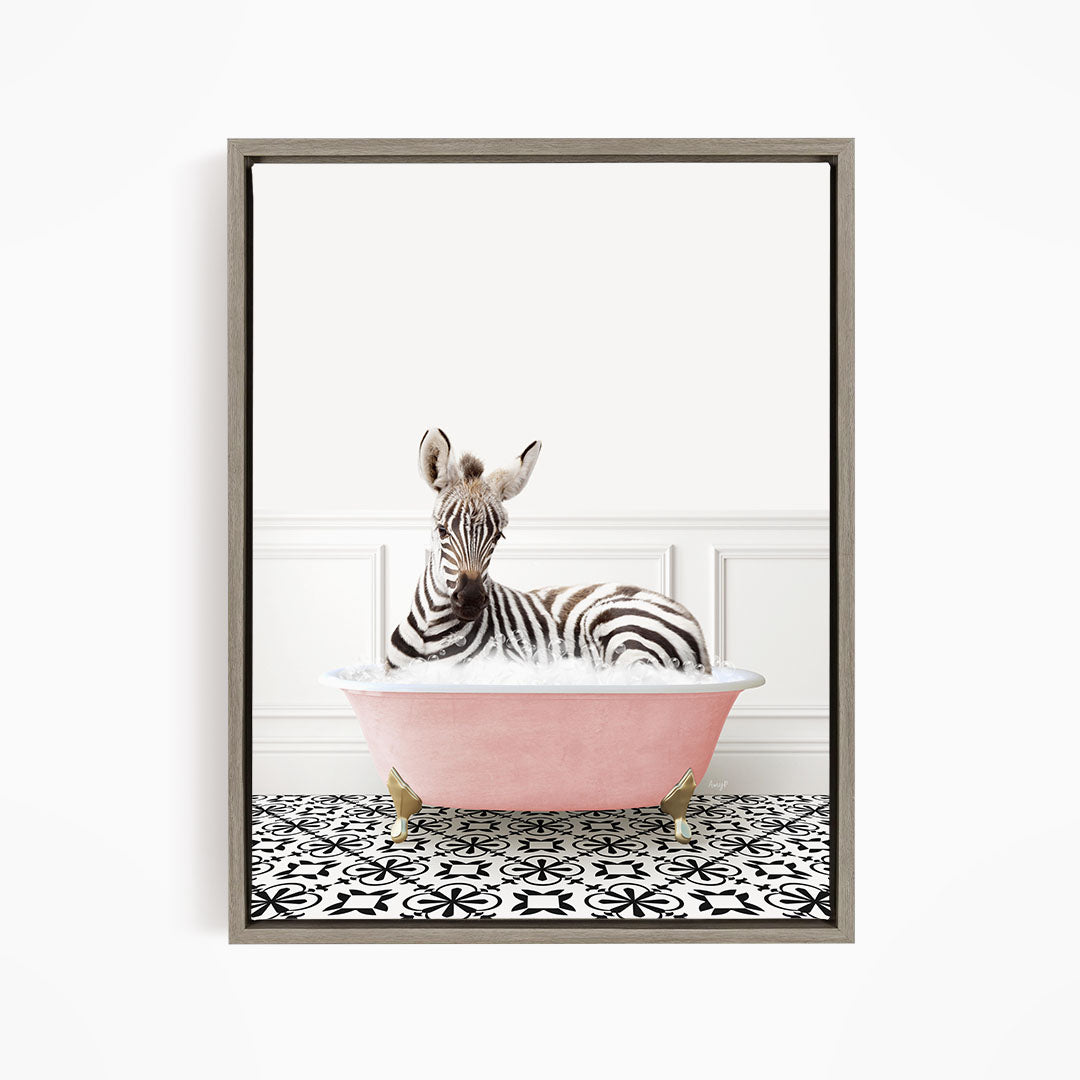 A zebra is sitting in a pink bathtub, surrounded by a black and white patterned floor.